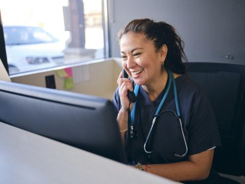 Health care provider talking on telephone