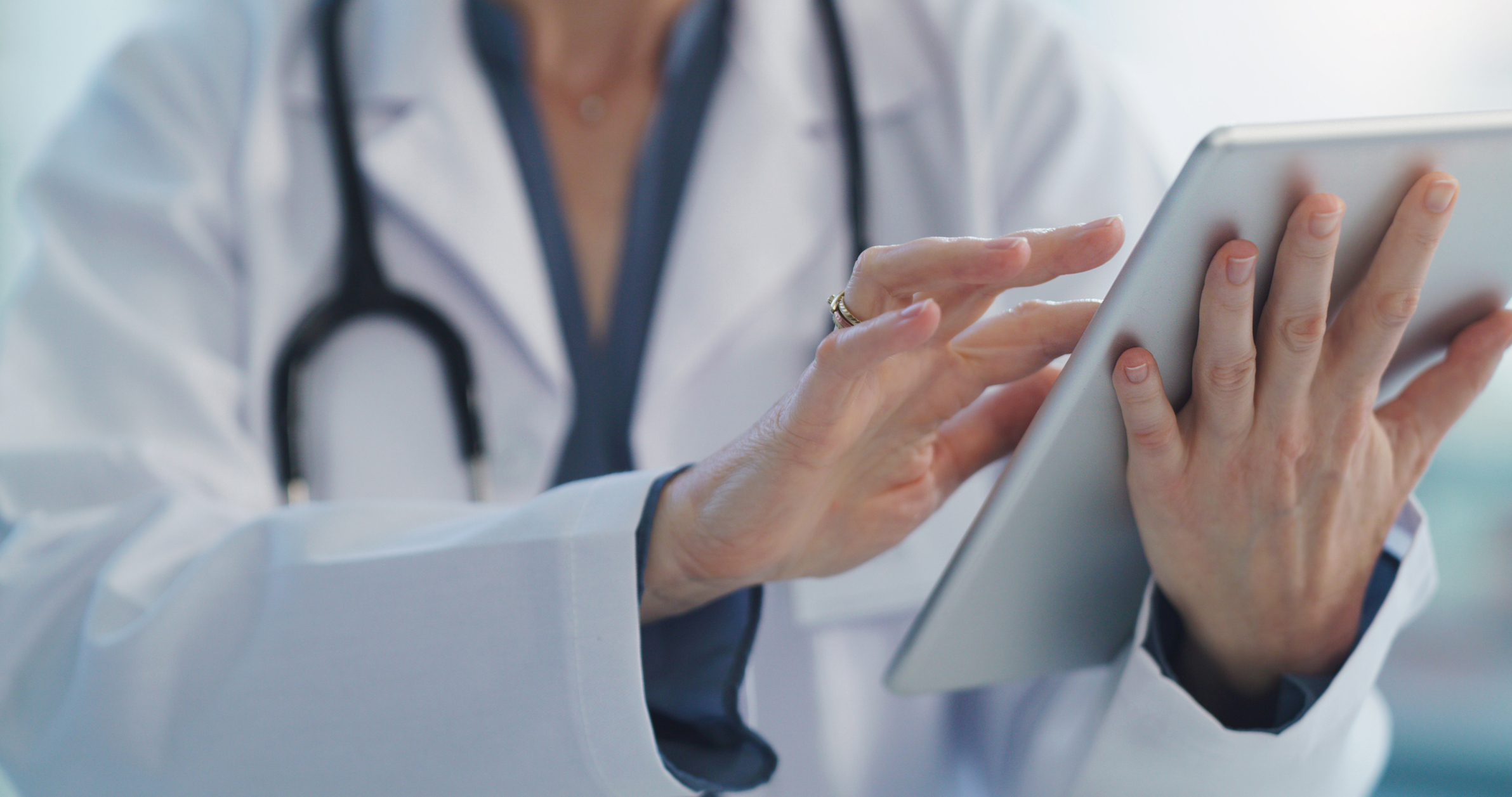 Clinician holding tablet